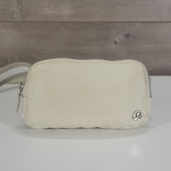 lululemon athletica Handbags - lululemon athletica Cream Wristlet Pouch with Silver Accent